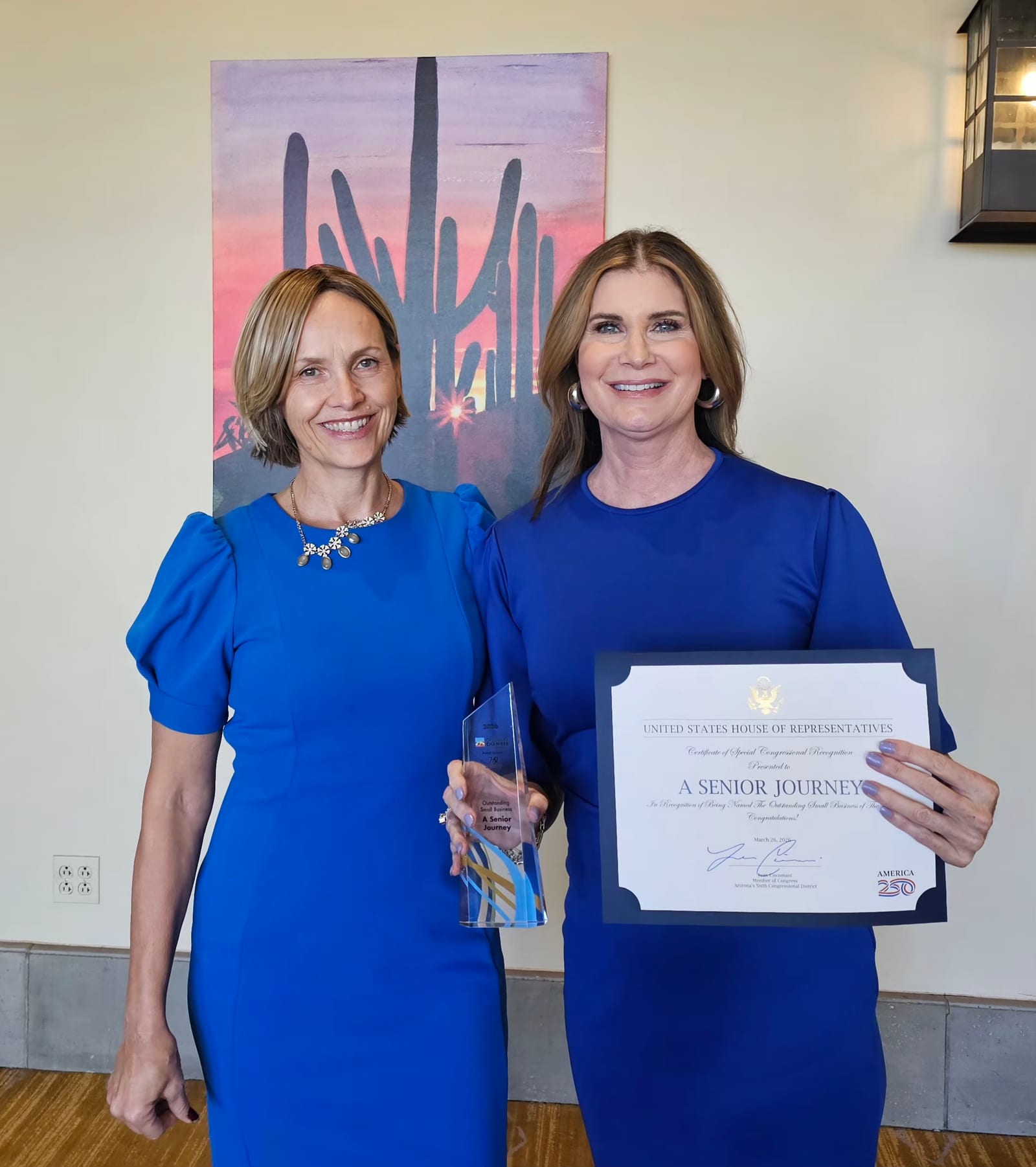Amanda Gelatt and Kristine Zwiers holding the US House of Representatives Congressional Recognition award for A Senior Journey